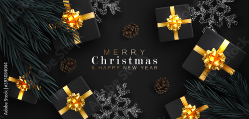 Merry Christmas and happy New year. Realistic background with voluminous gift boxes tied with a gold ribbon with bows. The view from the top. Fir branches and cones. And confetti snowflakes.