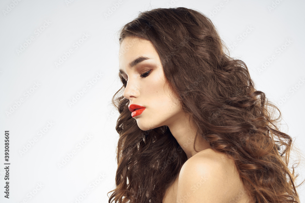 Fototapeta premium Elegant woman with bare shoulders red lips glamor attractive look cropped look