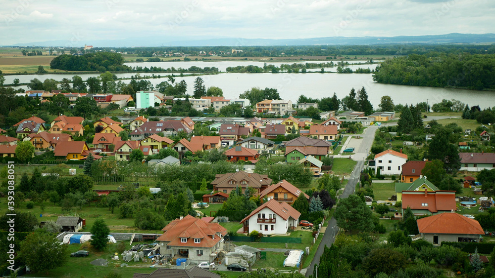 Town village Tovacov aerial panorama pond farming lake farm shot in the heart Hana of the culturally landscape of the village family houses and buildings fields wheat countryside Czech, Europe