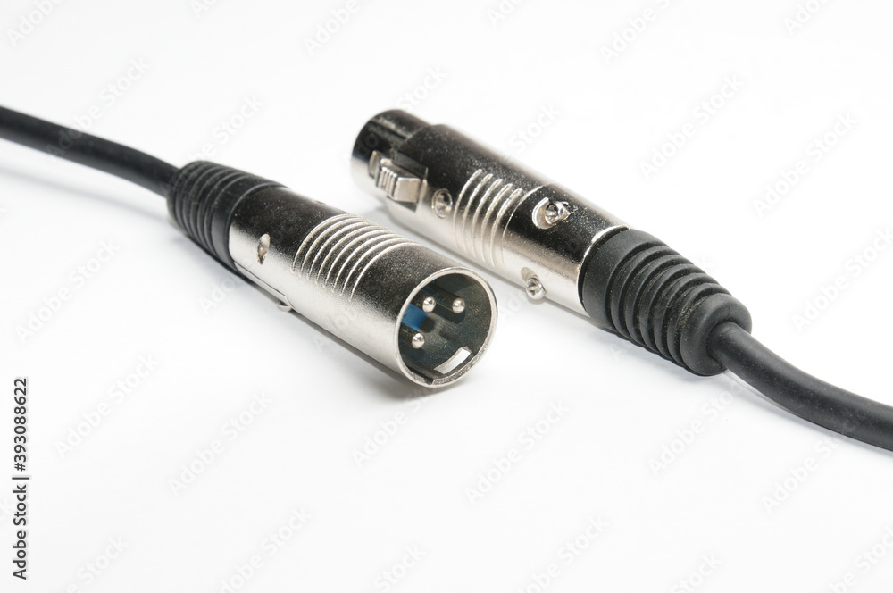 Audio cable with XLR connectors for microphones and professional audio equipment on a white background Audio cable with XLR connectors for microphones and professional audio equipment on a white background