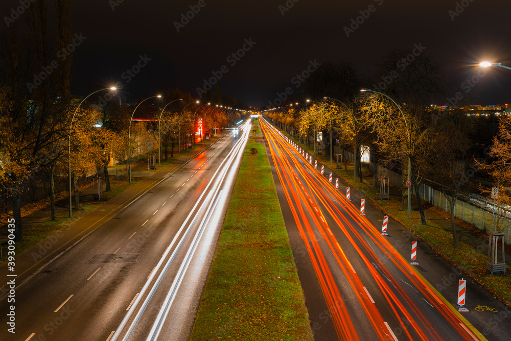 Light trails from cars on a street at night, a street at night in Berlin, Adlergestell in Berlin, Germany