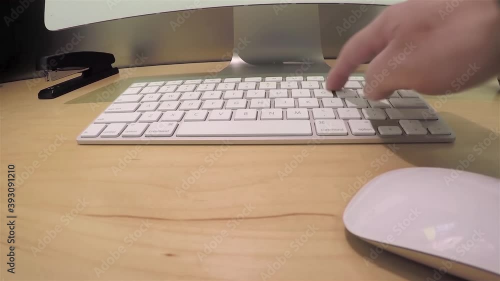 Man playing new apple computer inside Apple store with wide-angle camera shot