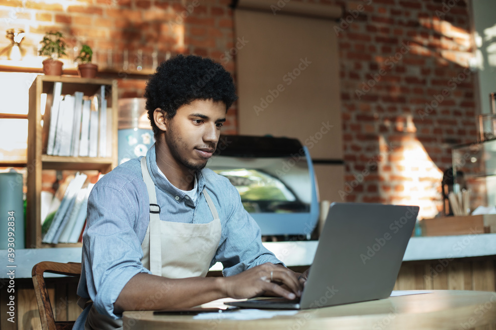 Man owner working and checking email on computer Man owner working and checking email on computer