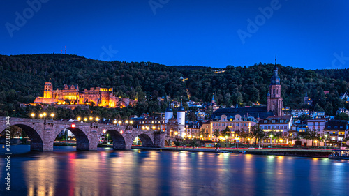 Old Bridge, Neckar, with castle of Heidelberg by night.