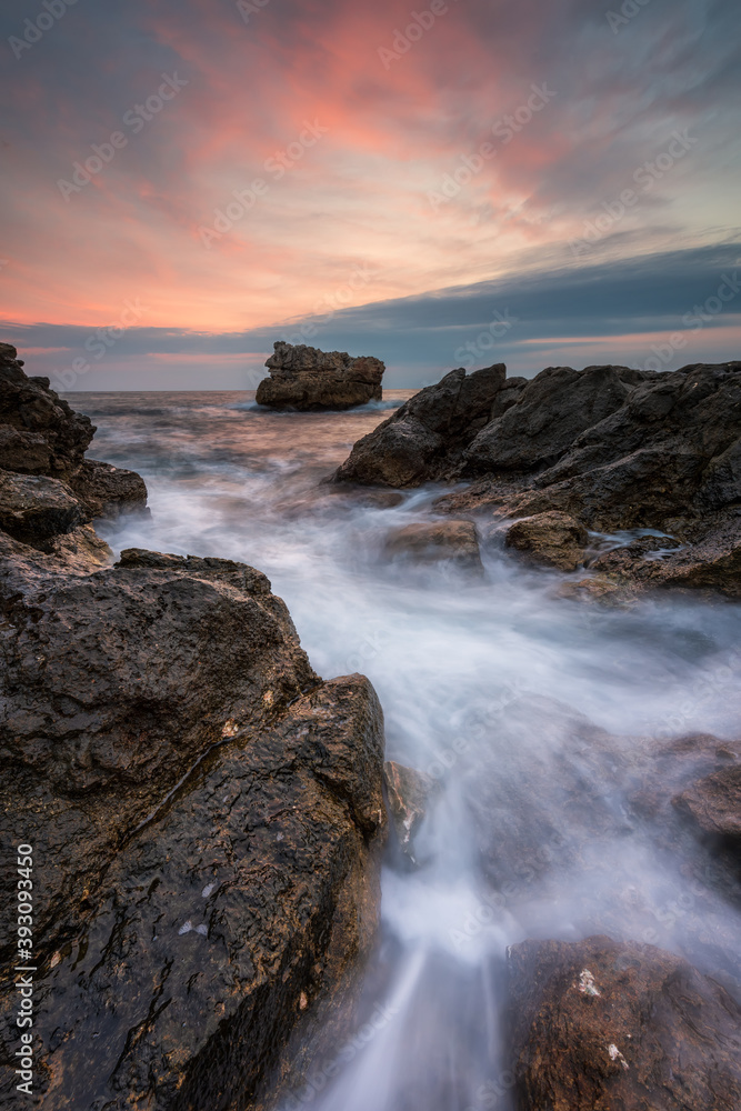 Stormy sea with beautiful morning sky at the rocky coastline of the Black Sea