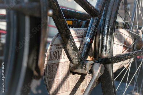 Running newspaper, bike chain channel