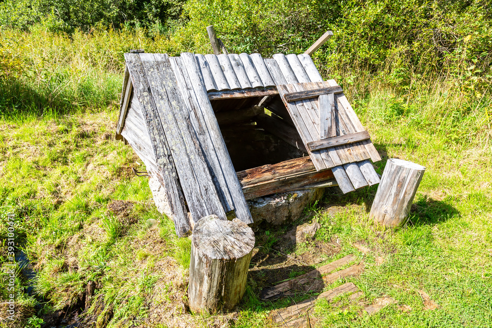 Old wooden water well at the countryside Old wooden water well at the countryside