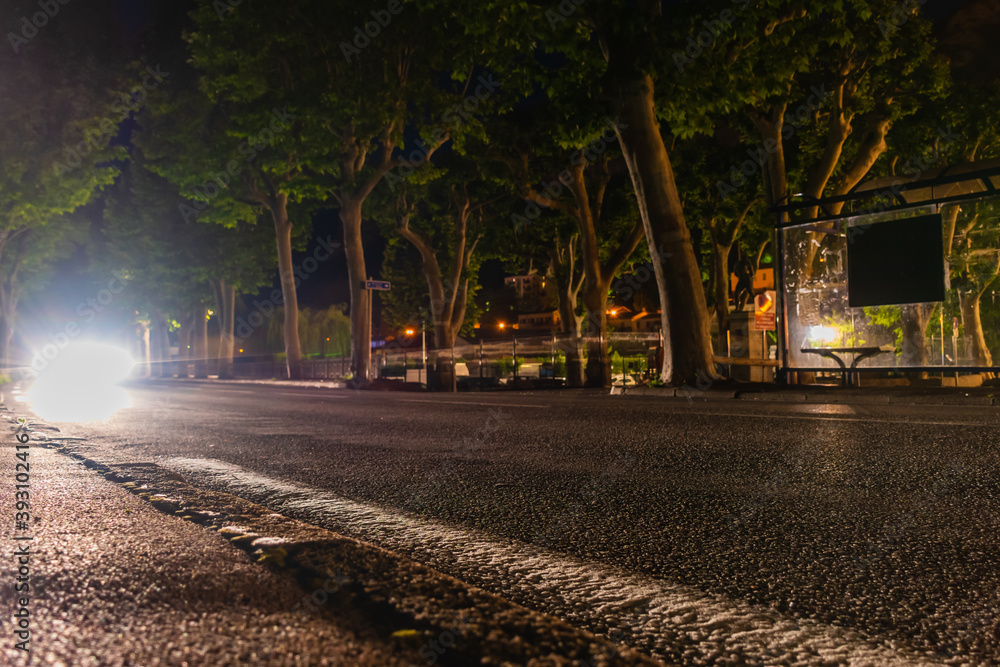 A long exposure shot of a car driving at night A long exposure shot of a car driving at night