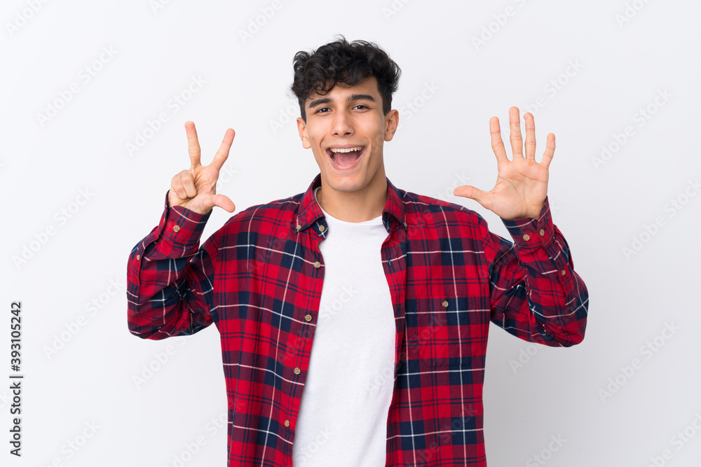 Young Argentinian man over isolated white background counting eight with fingers Young Argentinian man over isolated white background counting eight with fingers