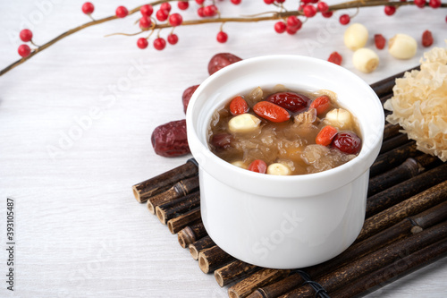 Close up of sweet snow white fungus soup with lotus seed, Chinese red dates and wolfberry. photo