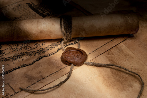 An old paper scroll sealed with a wax seal. The manuscript is rolled up and sealed.