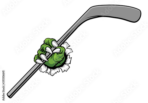 A monster claw or hand holding an ice hockey stick in its talons