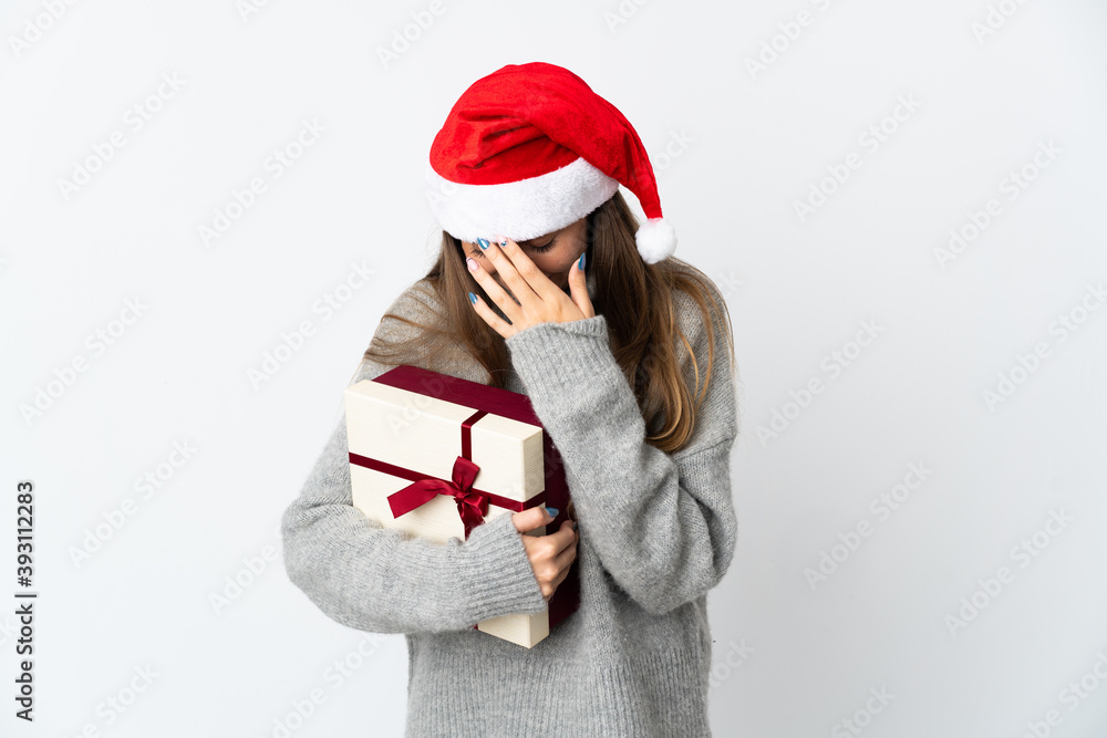 Lithianian woman with christmas hat holding presents isolated on white background laughing Lithianian woman with christmas hat holding presents isolated on white background laughing