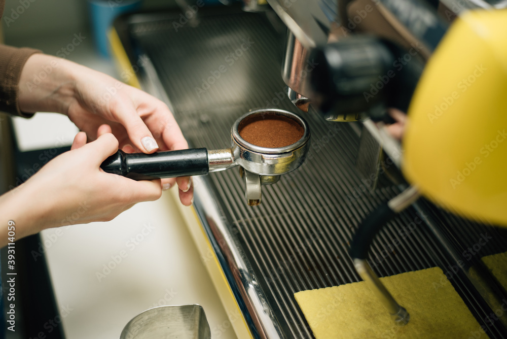 cappuccino machine pouring coffee, the ground coffee is prepared for brewing