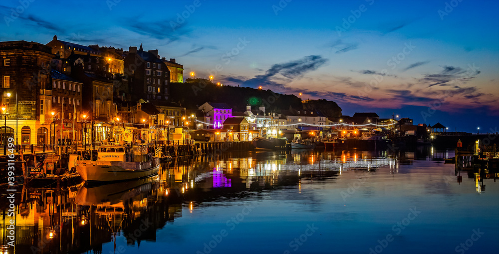 Whitby Harbour at night with sunset sky taken at Whitby, Yorkshire, UK on 21 May 2018