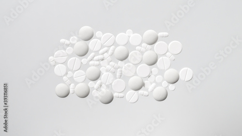 Fototapeta Naklejka Na Ścianę i Meble -  Various white medical pills on white background