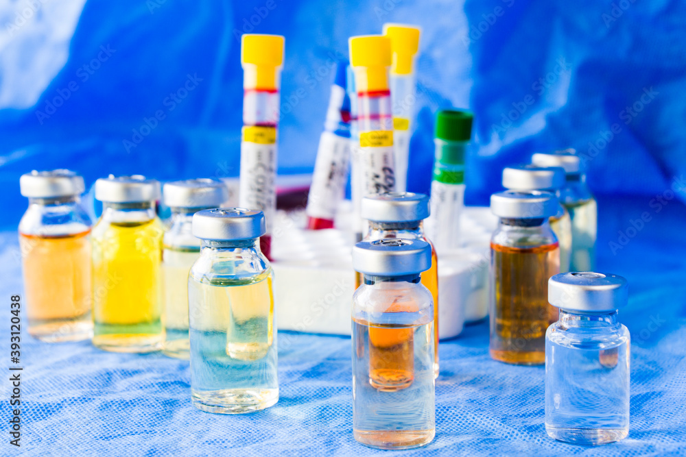 Corona virus and Covid - 19 new vaccine in ampules and blood tube, variations of vaccine Corona virus and Covid - 19 new vaccine in ampules and blood tube, variations of vaccine