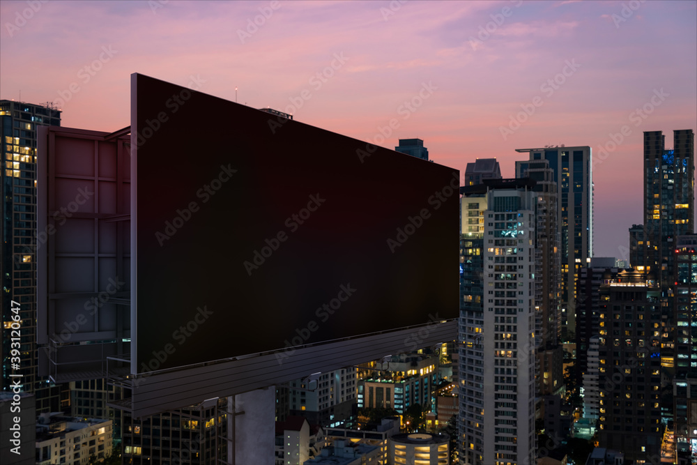 Blank black road billboard with Bangkok cityscape background at night time. Street advertising poster, mock up, 3D rendering. Side view. The concept of marketing communication to promote idea. Blank black road billboard with Bangkok cityscape background at night time. Street advertising poster, mock up, 3D rendering. Side view. The concept of marketing communication to promote idea.