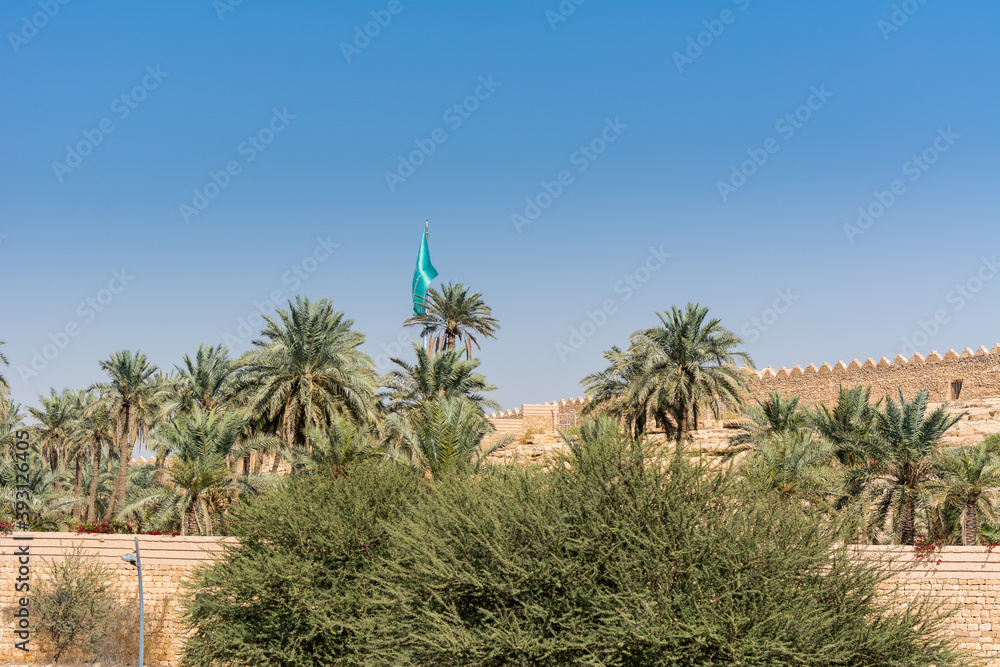 Date trees and ruins of Diraiyah clay castle, also as Dereyeh and Dariyya, a town in Riyadh, Saudi Arabia, was the original home of the Saudi royal family, and the capital of the Emirate of Diriyah.