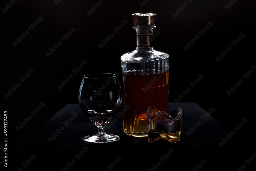 Brandy bottle, glass and candle stick Brandy bottle, glass and candle stick