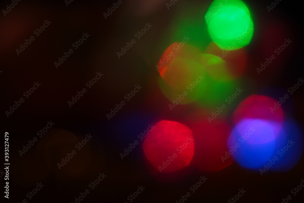 Evening bokeh. Background with highlights in blue, red, green, and yellow.