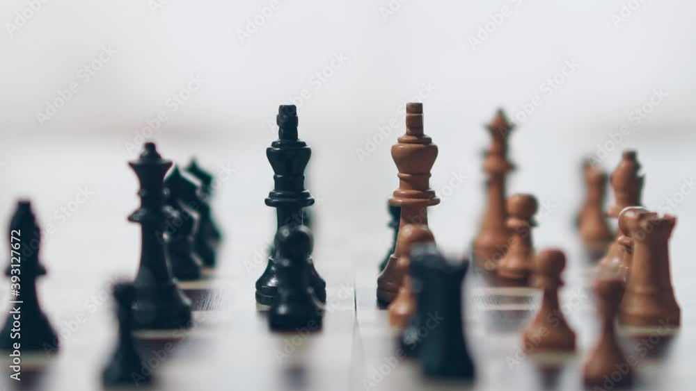 Chess: White knocking over the black teams king. Chess: White knocking over the black teams king.