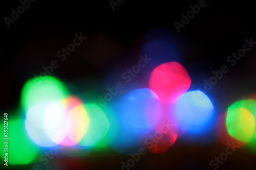 Evening bokeh. Background with highlights in blue, red, green, and yellow.