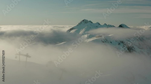 Establishing High Aerial View of Ski Resort Slopes in Russia Mountains photo