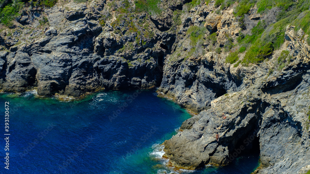 Steep cliff in the blue bay of Mediterranean sea, Calanques