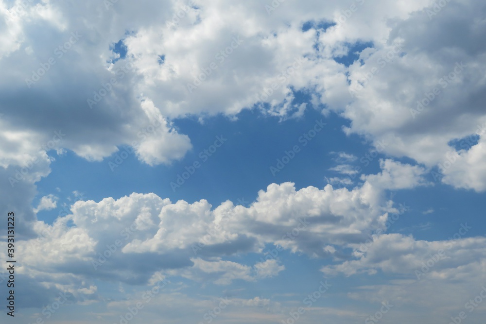 Blue sky with fluffy clouds