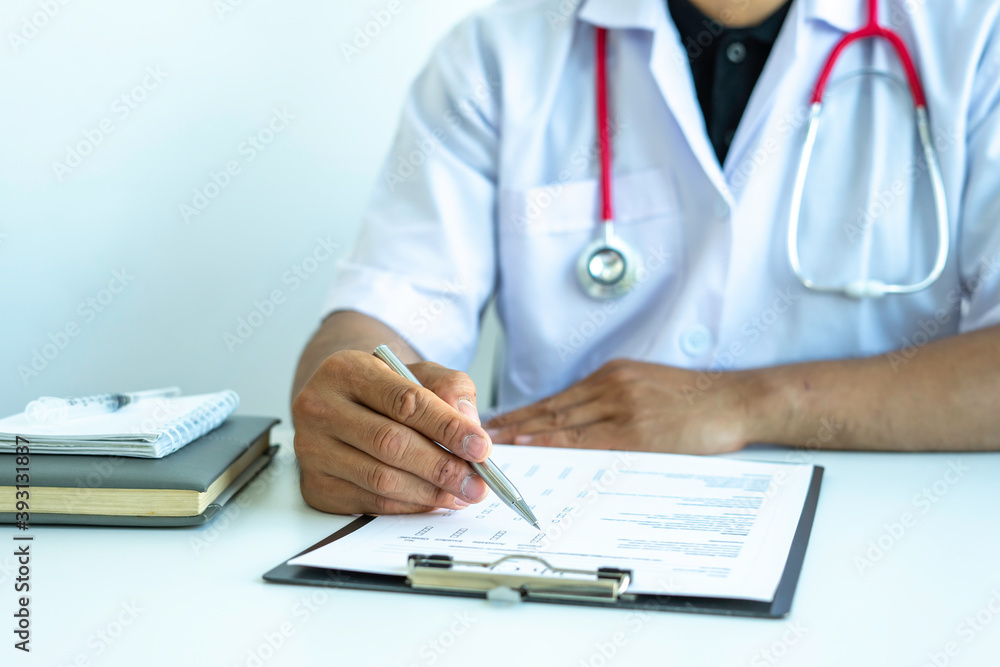 The doctor is reading a checklist of the results of the patient's health check to plan the treatment regimen, concept of analysis. And treatment planning for the patient