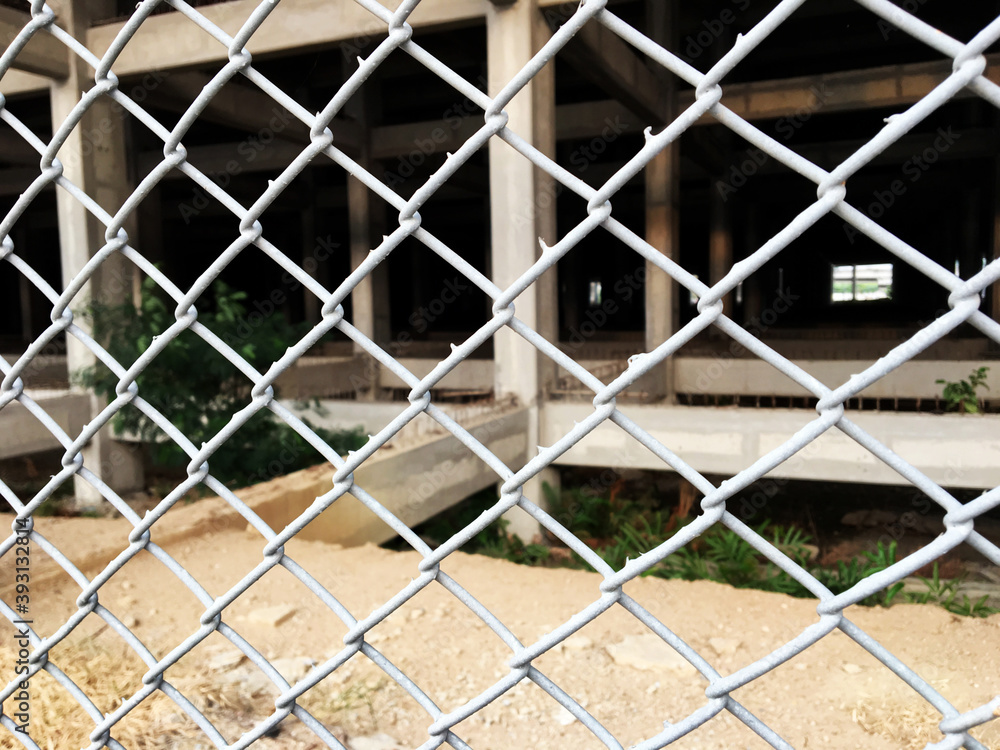 Fototapeta premium Wire stainless steel grey color, chain link fence, seamless texture metal wire protective fence.