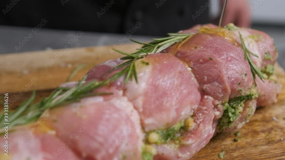 The chef pours oil over a piece of meat, prepares the food to put it in the oven. The chef pours oil over a piece of meat, prepares the food to put it in the oven.