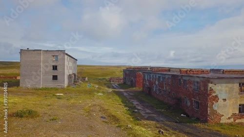 Aerial view of an abandoned village Cape Skorbeewski - a former military garrison on the Peninsula Rybachiy, Russia. photo