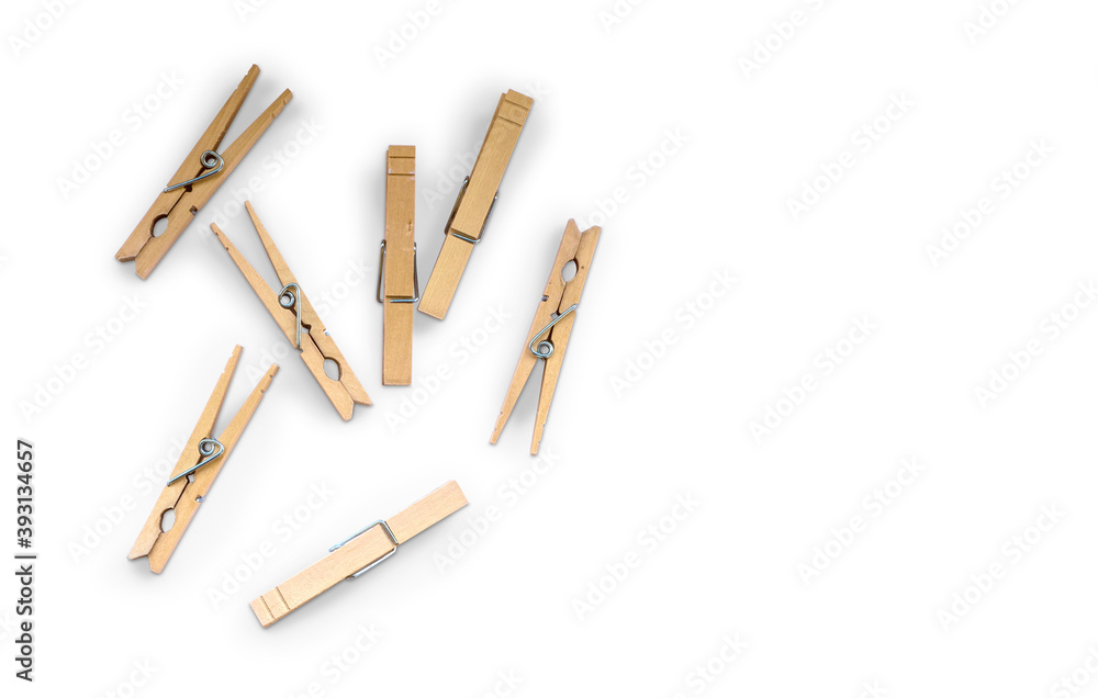 Wooden clothspins isolated on white background with copyspace Wooden clothspins isolated on white background with copyspace