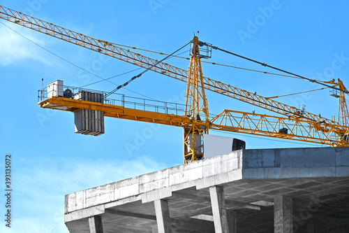 Crane and highrise construction site