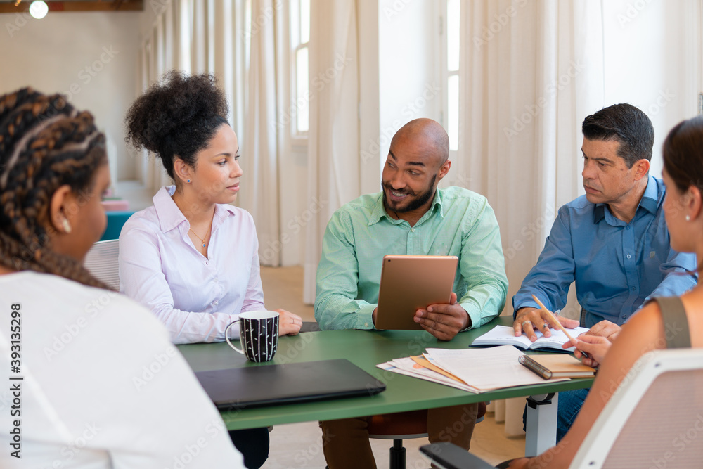 Confident african american man explaining project details in business cowork space. Teamwork, corporate, planning, strategy concept.. Confident african american man explaining project details in business cowork space. Teamwork, corporate, planning, strategy concept..