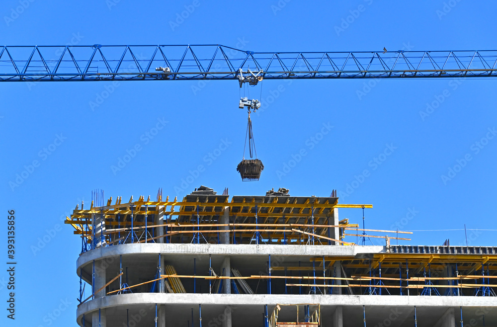 Fototapeta premium Crane and highrise construction site