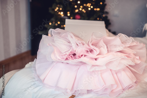 Luxury pink dress in white box.