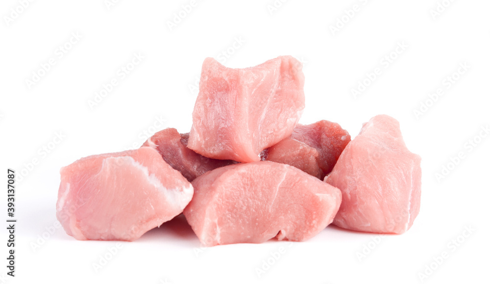 Pile of pork uncookes chopped cubes close up isolated on white background Pile of pork uncookes chopped cubes close up isolated on white background