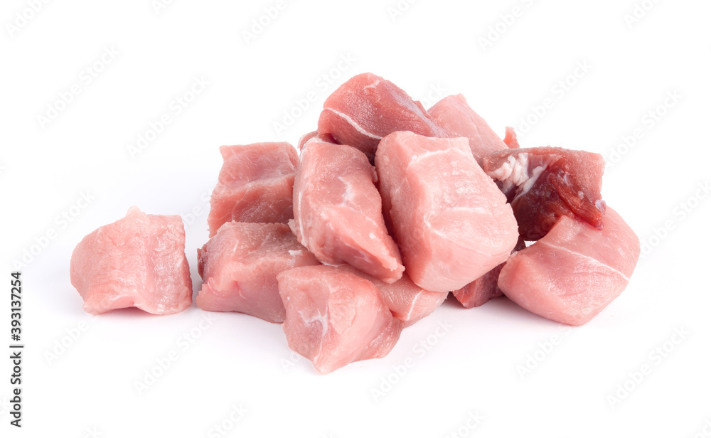 Pile of pork uncookes chopped cubes close up isolated on white background Pile of pork uncookes chopped cubes close up isolated on white background