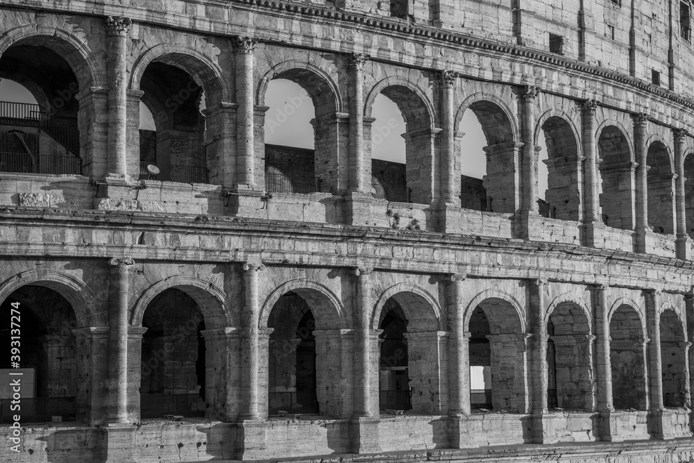 The architecture of the Colosseum in black and white editing
