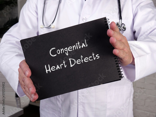 Health care concept meaning Congenital Heart Defects with inscription on the piece of paper.