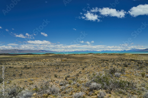 vast open landscape in Patagonia at turquoise Lago Viedma close to Fitz Roy mountain with snow covered mountains of the Andes in the background