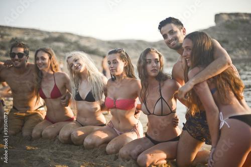 group of young people have fun at the beach
