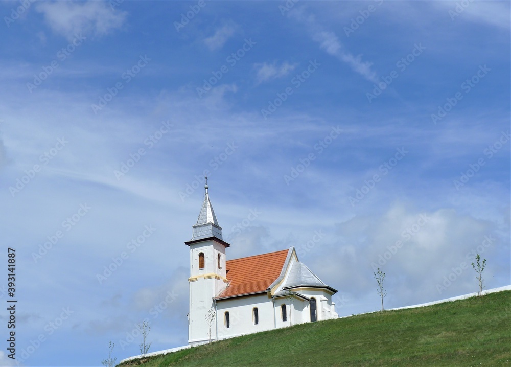 church on grass hill