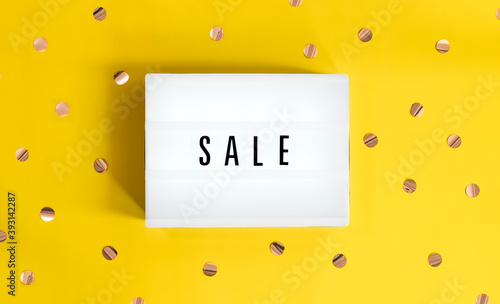 Lightbox with a sign sale starts on yellow festive background. Concept sale, black friday, cyber monday, season sales.