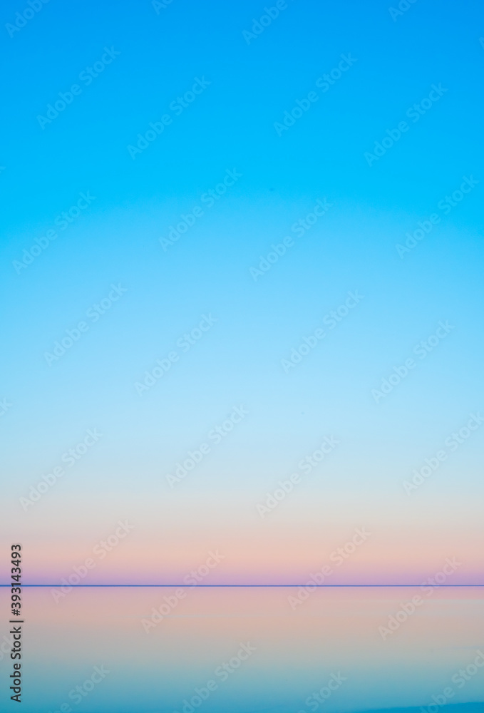 Cloudless sunset sky over sea