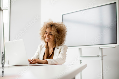 Young curly hair woman work...