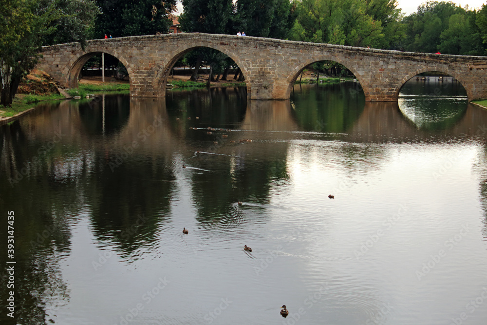 Old bridge over river in Spain, Europe Old bridge over river in Spain, Europe